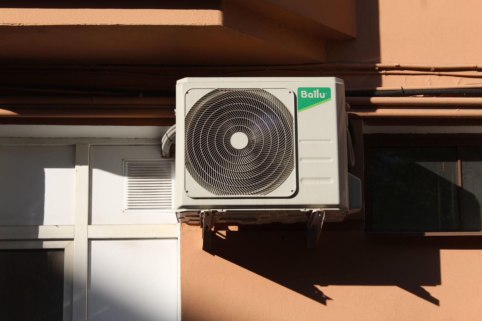Digital wall thermostat controlling a home heating and cooling system